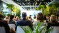 Group of People Sitting in Chairs Facing Stage Royalty Free Stock Photo