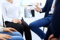 Group of people sitting in a circle during therapy. Meeting of business team participating in training Royalty Free Stock Photo