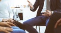 Group of people sitting in a circle during therapy in office. Meeting of business team participating in training Royalty Free Stock Photo