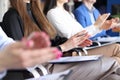 Group of people sitting on educational business course and clapping their hands closeup