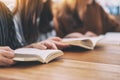 Group of people sitting and enjoyed reading book together