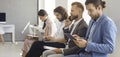 Group of people sitting in line waiting for job interview or business appointment Royalty Free Stock Photo