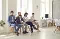 Group of people sitting in office and waiting for job interview or business meeting Royalty Free Stock Photo