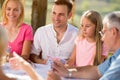 Group of people sitting and playing cards Royalty Free Stock Photo