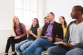 Group of people sitting at seminar, copy space