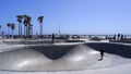 Group of people skateboarding at Venice beach in Los Angeles, United States