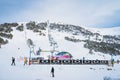 Group of people, skiers and snowboarders taking on ski lift in Pyrenees, Andorra