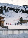 Group of people skiing at a ski resort slope facility