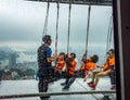 Group of people on Sky Walk at Macau Tower in rainy day Royalty Free Stock Photo