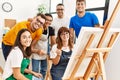 Group of people smiling happy and looking draw of partner at art studio Royalty Free Stock Photo