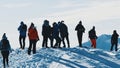 Group Of People On Snowy Landscape having fun Snow Covered Mountains Royalty Free Stock Photo