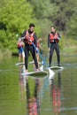 group people stand up paddleboarding Royalty Free Stock Photo