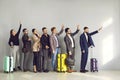 Group of people standing at the airport, waving hands, saying goodbye to their friends Royalty Free Stock Photo