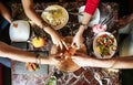 Group of People Standing Around a Table With Plates of Food Royalty Free Stock Photo