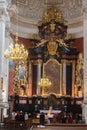 Group of people standing in awe in a grand cathedral during wedding ceremony in Poland, Krakow