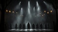 A group of people standing in a dark room with lights Royalty Free Stock Photo