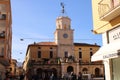 A group of people standing in front of a building-orbetello Tuscany