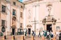 Group of people standing in front of church in old town Krakow, Poland Royalty Free Stock Photo