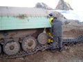 A group of people standing in front of a truck antarctica