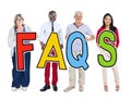 Group of People Standing Holding Word FAQS