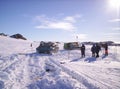 A group of people standing on top of a snow covered slope Antarctica Royalty Free Stock Photo