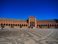 people are walking outside an ornate courtyard on a sunny day