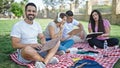 Group of people students sitting on grass studying at park Royalty Free Stock Photo