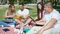 Group of people students sitting on grass studying at park Royalty Free Stock Photo