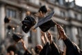 A group of people are throwing their graduation caps in the air Royalty Free Stock Photo