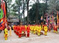 Group of people in traditional costume give gifts to the holy