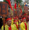 Group of people in traditional costume give gifts to the holy