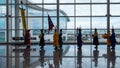 A group of people in traditional Korean man dress prepare to parade through the airport