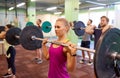 Group of people training with barbells in gym Royalty Free Stock Photo