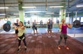 Group of people training with barbells in gym Royalty Free Stock Photo