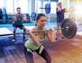 Group of people training with barbells in gym Royalty Free Stock Photo