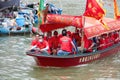 Group of people traveling with a red boat at the dragon boat festival in Taio O, Hong Kong Royalty Free Stock Photo