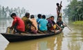 Group of people travelling on a boat around a river in India