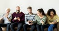 Group of people using mobile phone on couch Royalty Free Stock Photo