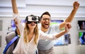 Group of people using virtual reality headset at exhibition, show. VR technology simulation concept