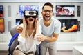 Group of people using virtual reality headset at exhibition, show. VR technology simulation concept