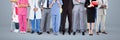 Group of People with various job careers standing with grey background