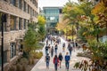 A group of people walking down a bustling street next to towering buildings, A bustling campus filled with diverse buildings and