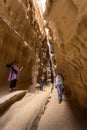 Group of people walking down a rocky canyon path in Qeshm, Iran Royalty Free Stock Photo