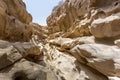 Group of people walking down a rocky canyon path in Qeshm, Iran Royalty Free Stock Photo