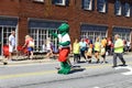 A group of people walking in the fourth of July parade Royalty Free Stock Photo