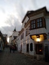 A group of people walking in front of a building in Szentendre