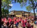 A group of people walking in the gay pride parade near Whyte Avenue, in Edmonton, Alberta, Canada. Many our young families. Peop