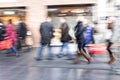 Group of people walking in shopping centre, zoom effect, motion Royalty Free Stock Photo