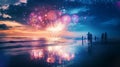 Group of people watching fireworks on the beach at beautiful sunset with reflection Royalty Free Stock Photo
