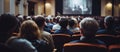 Photo of a group of people enjoying a movie on a big screen